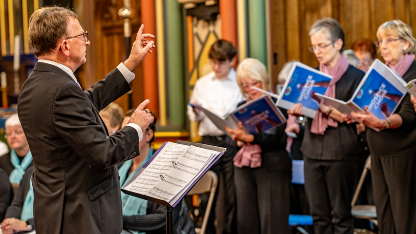 Paul Firth leads the choir