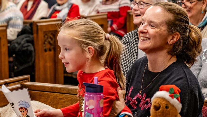 A child joins in with12 Hospice Days of Christmas