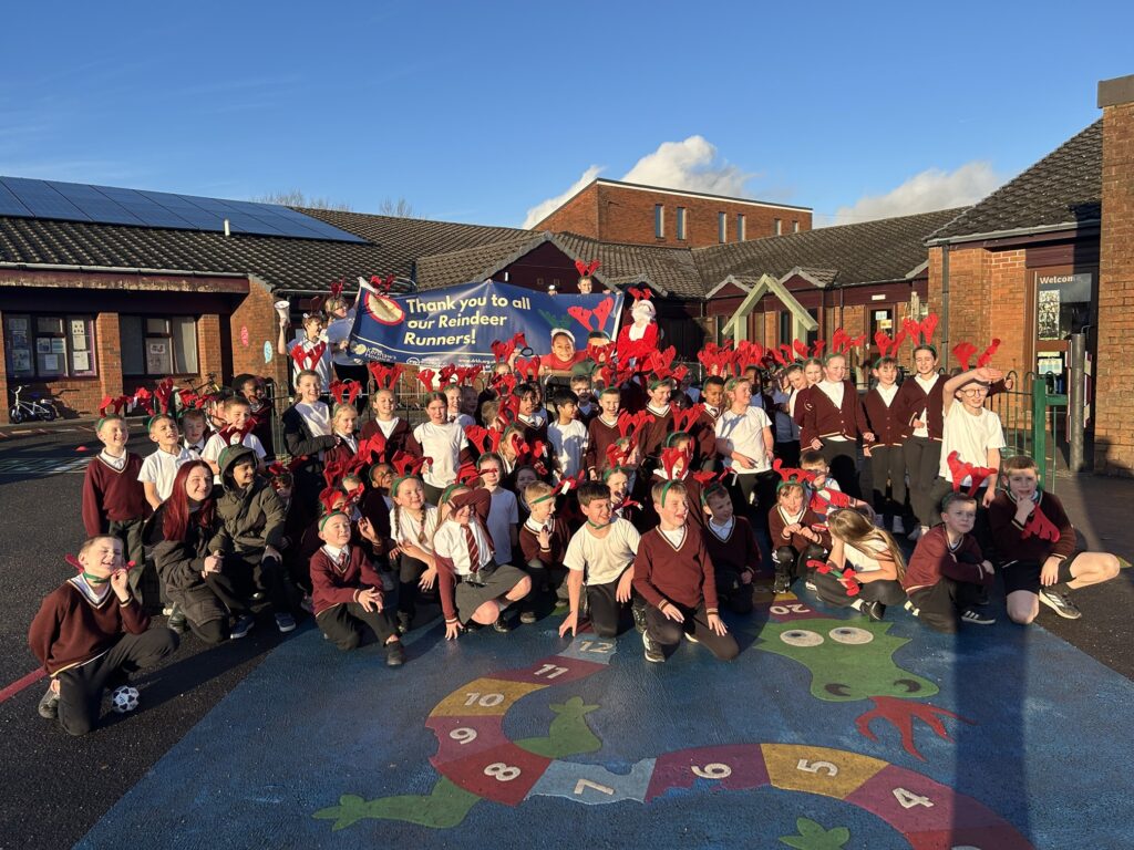 Crowd of children in antlers in a school playground