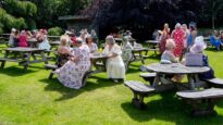 Women sat on benches outside