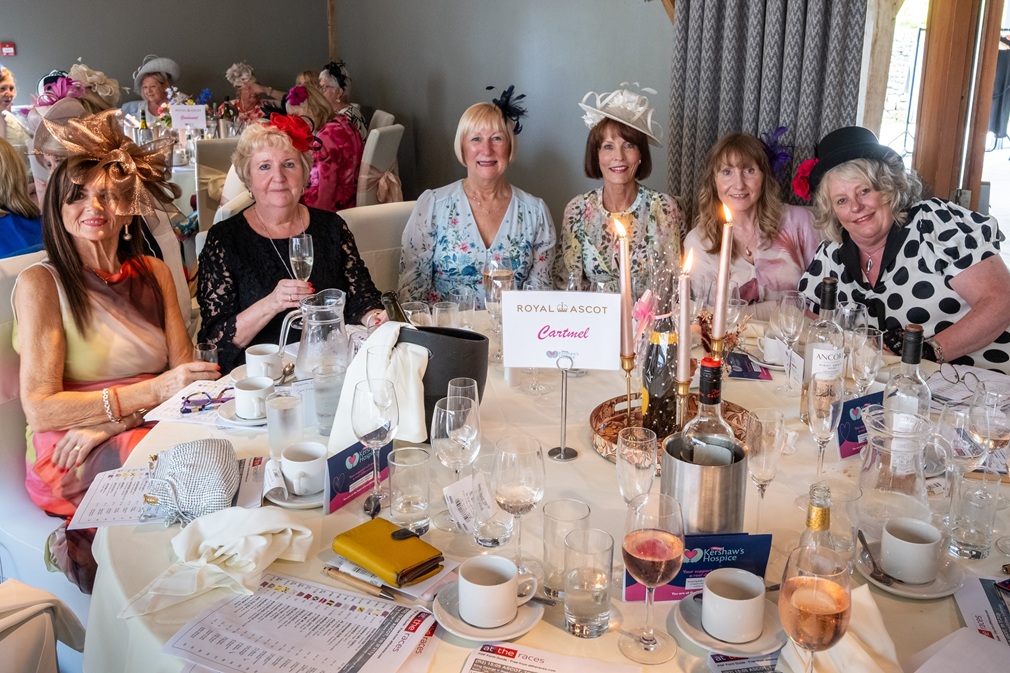Women sat around a beautifully decorated table