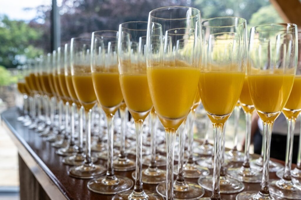 Glasses of Buck's fizz lined in a row