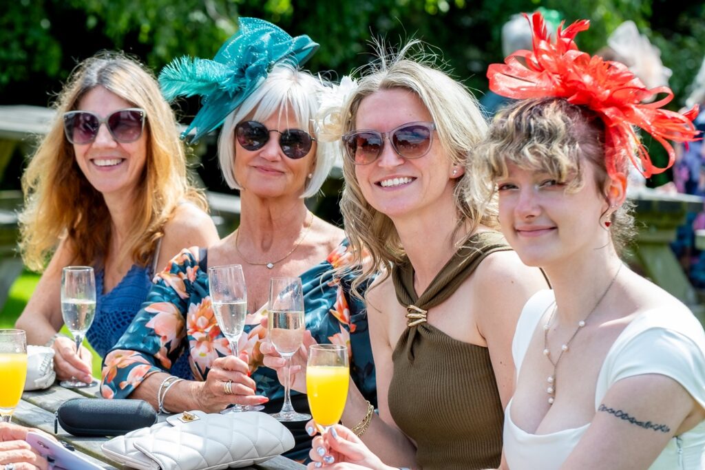 Group of women sitting outside with drinks