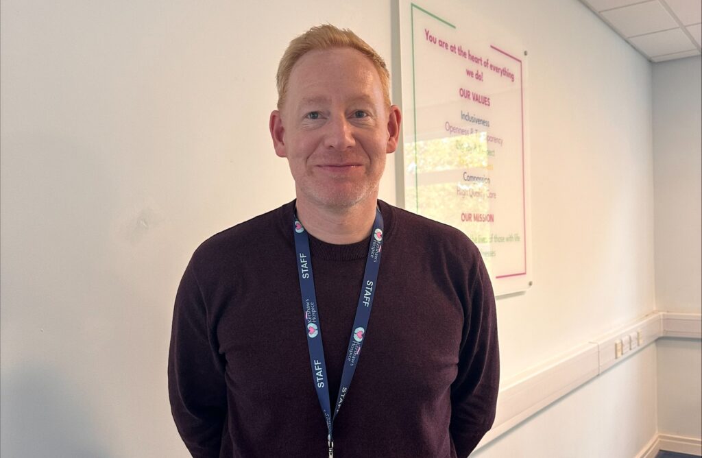 Ginger man smiling warmly